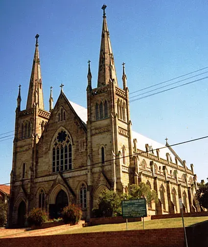 A large church with a blue sky in the background