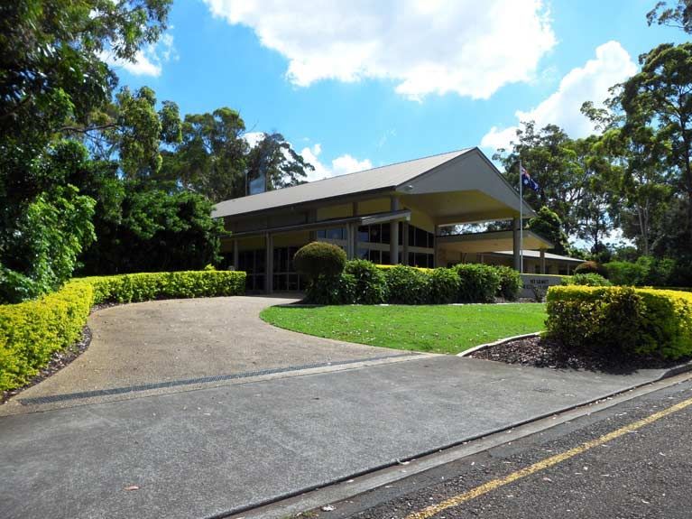 A large house with a driveway leading to it