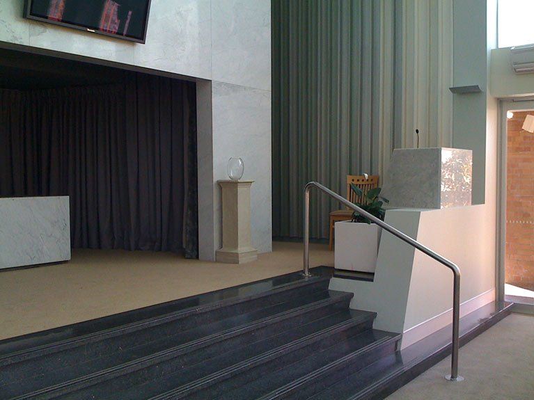 Stairs leading up to a podium in a church