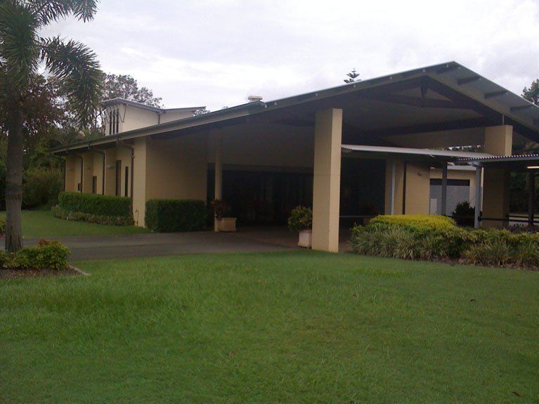 A large house with a large lawn in front of it