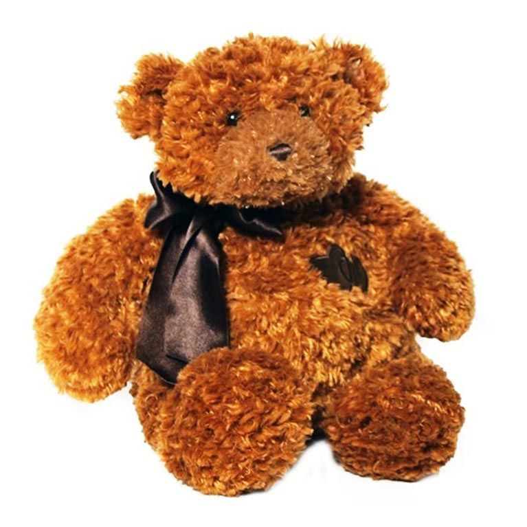 A brown teddy bear with a black bow around its neck