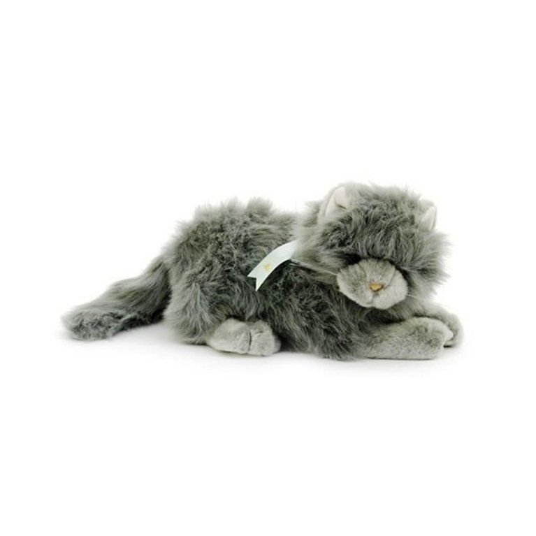 A stuffed cat with a white ribbon around its neck is laying down on a white background.