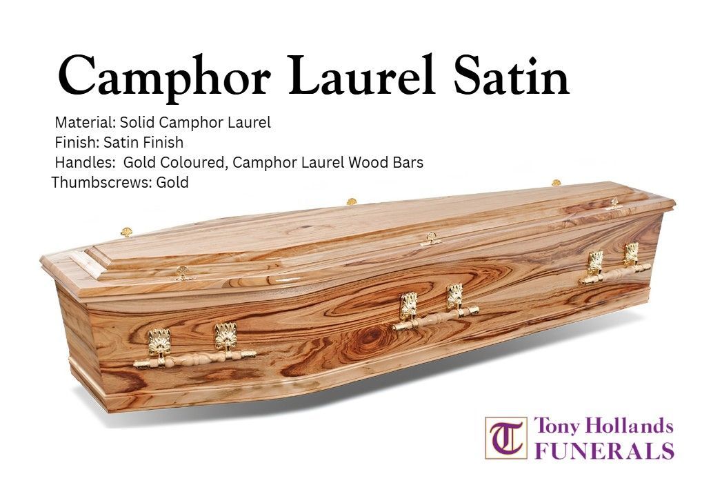 A coffin with a golf ball and roses on it
