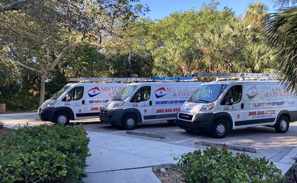 A man is using a cell phone while working on a machine in Fort Lauderdale FL