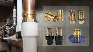 Plumber Connecting Pipes Under Sink — Abbottstown, PA — John M. Wilhide Plumbing & Heating Inc