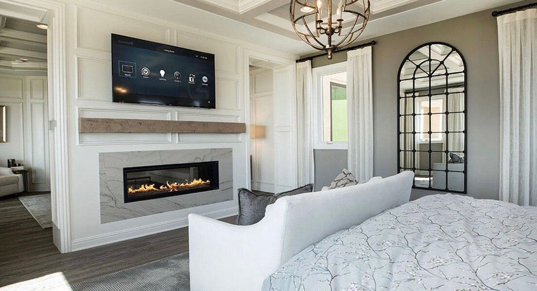 Room covered in plastic sheeting, likely for painting or renovation. Furniture and walls obscured.