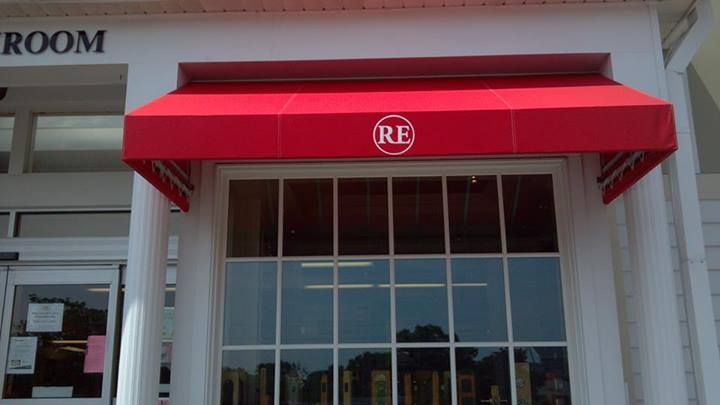 A red awning is covering the entrance to a room