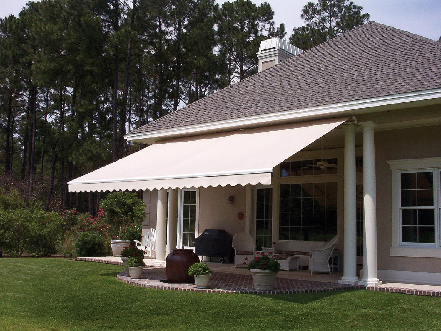 A house with a white awning over the porch