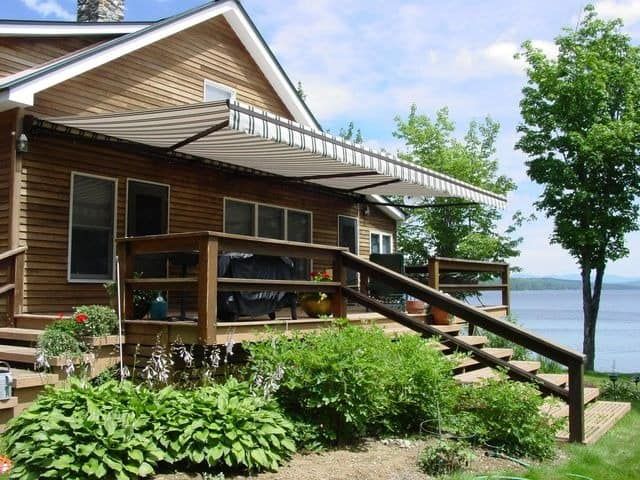 A house with a deck overlooking a body of water