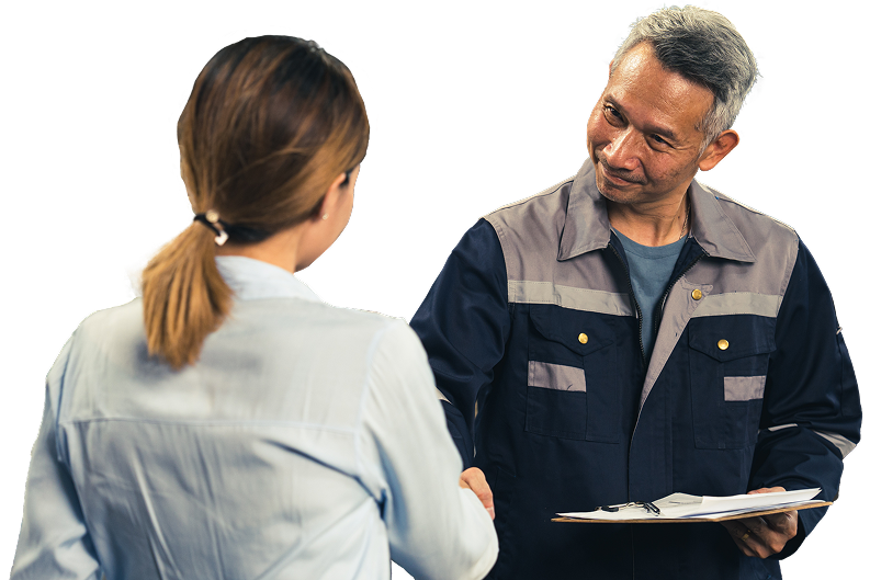 A person in a blue work uniform holding a clipboard shakes hands with another person shown from the back | Firos Auto House 2