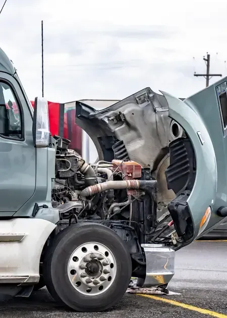 A close-up, cutaway view showing the internal metal gears, shafts, and components of an automotive transmission.