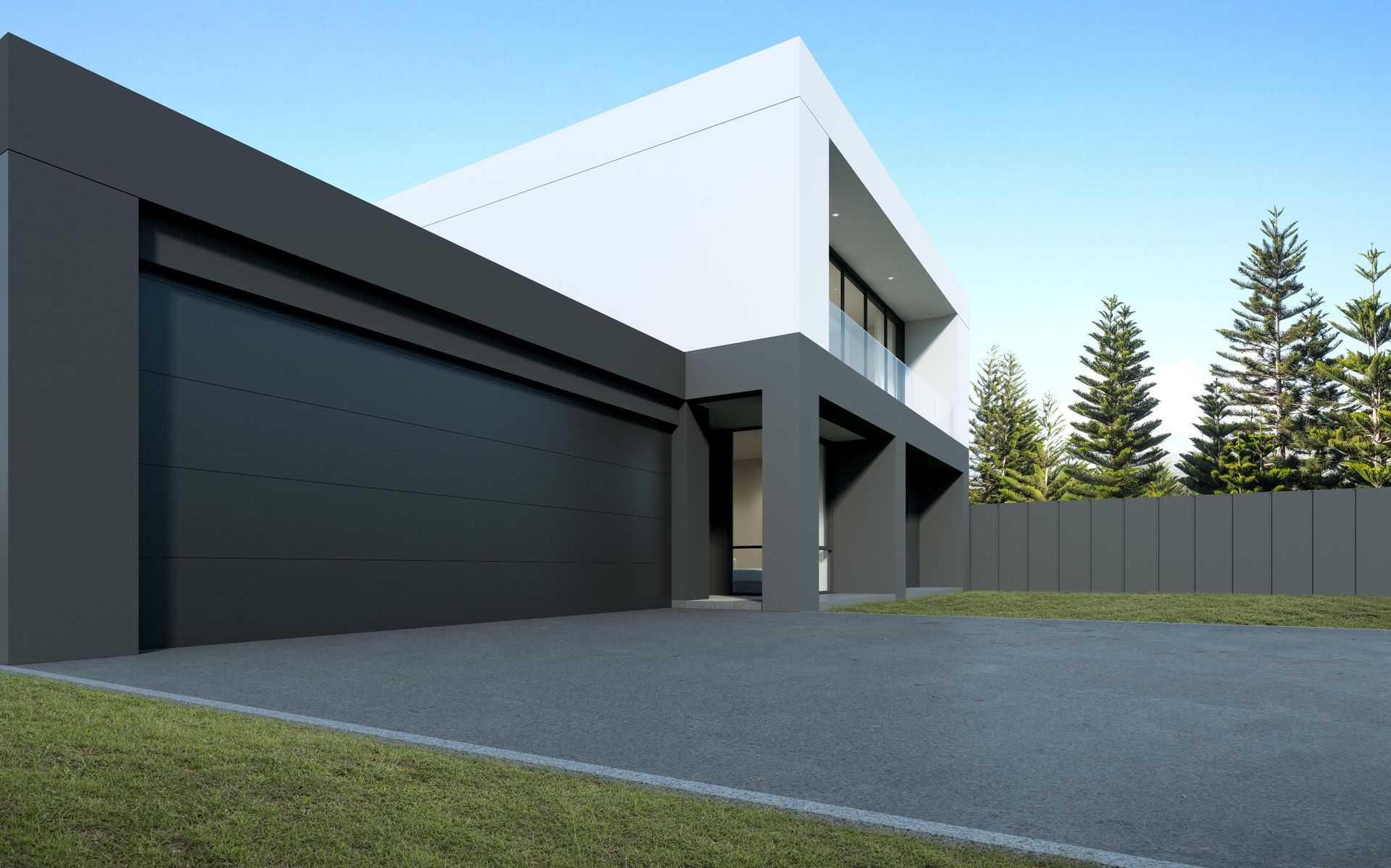 Modern house with gray garage door, white upper level, and gray driveway.