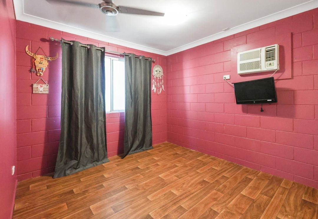 A Bedroom With a Ceiling Fan — Outback Auctions and Real Estate in Normanton, QLD