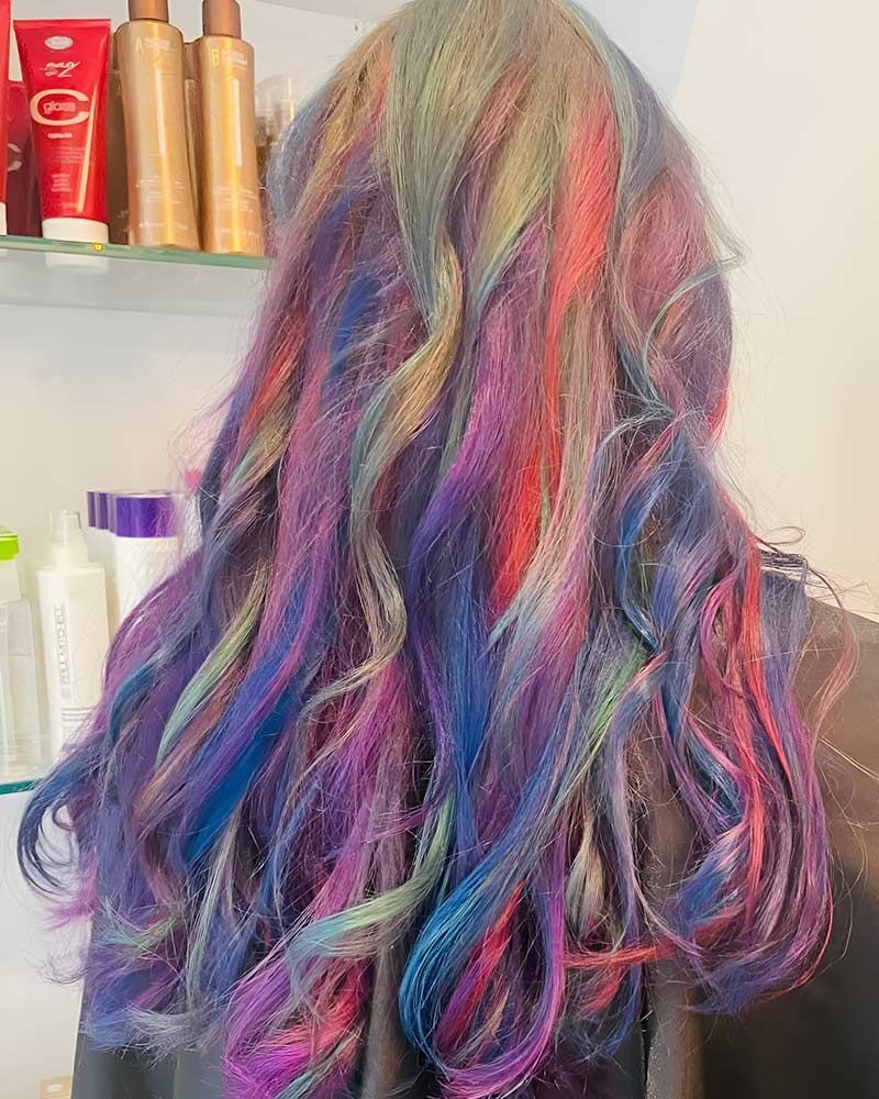A Woman With Long Colorful Hair — Artistry of Hair in Redlynch, QLD