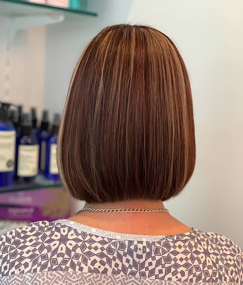 The Back of a Woman's Head With a Bob Hairstyle and a Necklace — Artistry of Hair in Redlynch, QLD