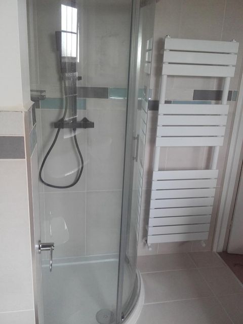 new bathtub and toilet fitted for bathroom
