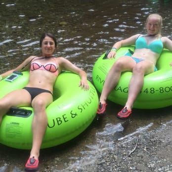 2 girls in tubes on the river