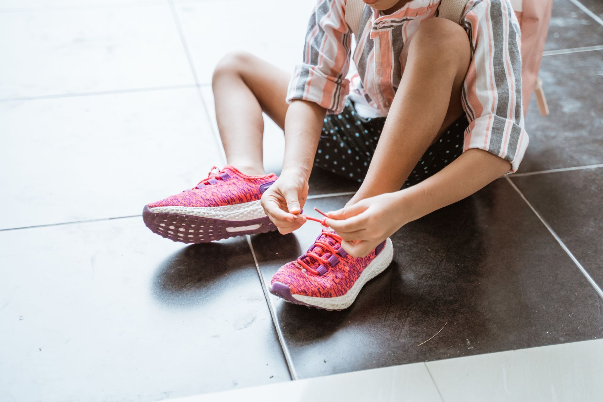 child wearing tennis shoes