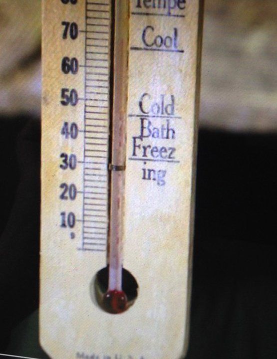 A thermometer used for preparing cold tubs. It is a wooden thermometer marked at various points. Approximately thirty degrees Fahrenheit is marked “Freezing,” approximately forty-five degrees is marked “Cold Bath” and approximately sixty-five degrees is marked “Cool.”