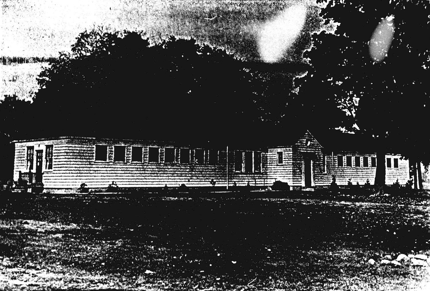 Cottage F, the location of the Resperin experiments, was a long narrow one storey wooden frame building, located next to the institution cemetery. This building was erected in the late 1930s or early 1940s and originally housed farm labourers. The building had only one washroom and no washing facilities. Following the end of the Resperin experiments in 1968, this building was used for storage. It was demolished sometime in the late 1970s. Image from the Regional Centre Records.