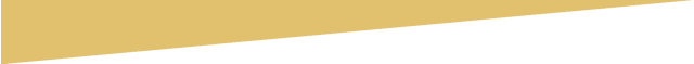 A close up of a yellow triangle on a white background.