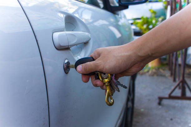 Selective Focus on Car Key Remote and Tools in Man's Hand Open the Car Door | Brendale, Qld | Abc Locksmiths
