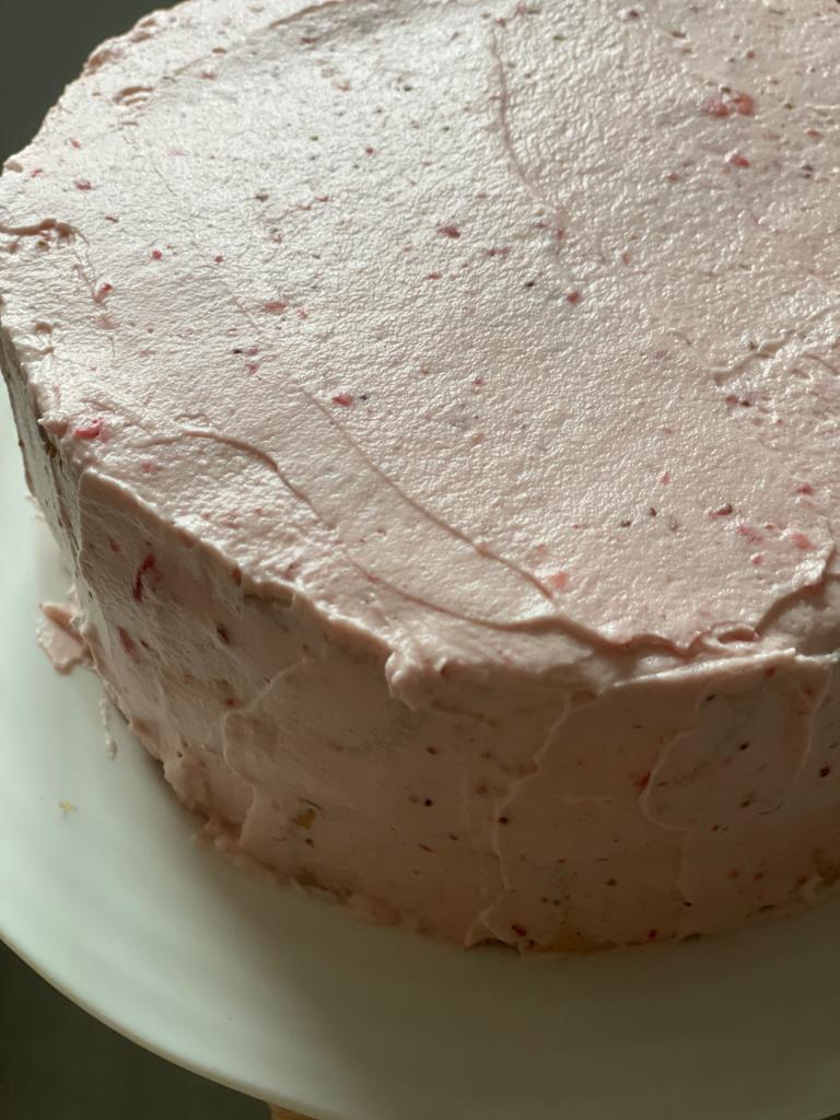 Cake decorated with strawberry cream