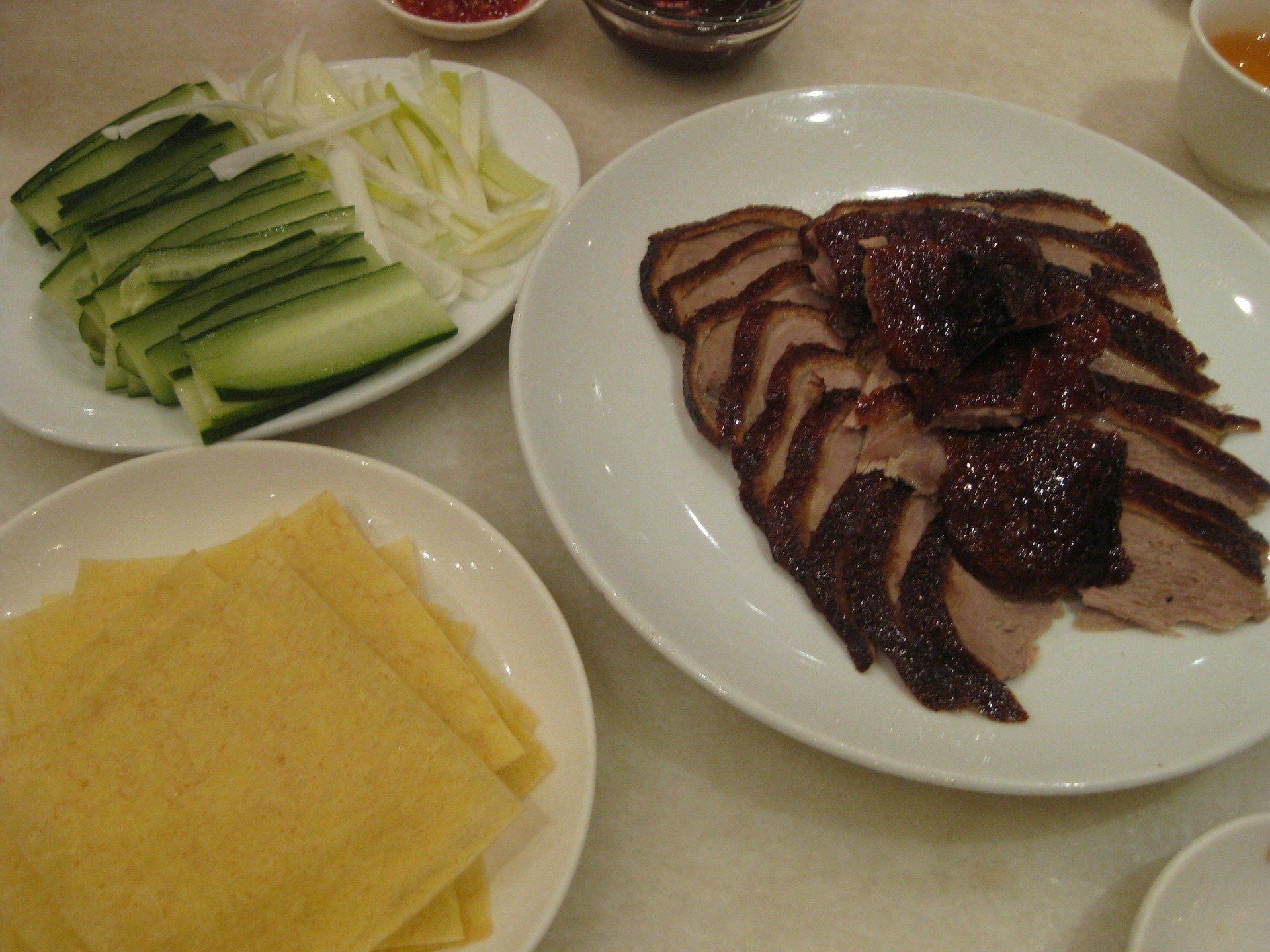 Peking roasted duck with pancakes, cucumber, onion, sauce.