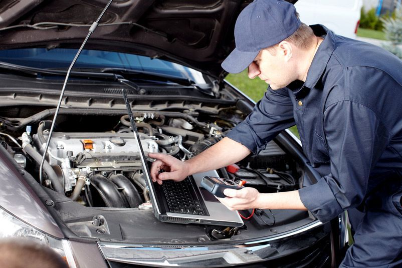 Professional Car Mechanic Working in Auto Repair Service — Total Auto Service In Caloundra West, QLD