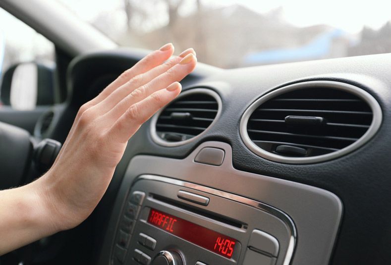 Woman Hand Checking Operation of Air Conditioner in Car — Total Auto Service In Caloundra West, QLD