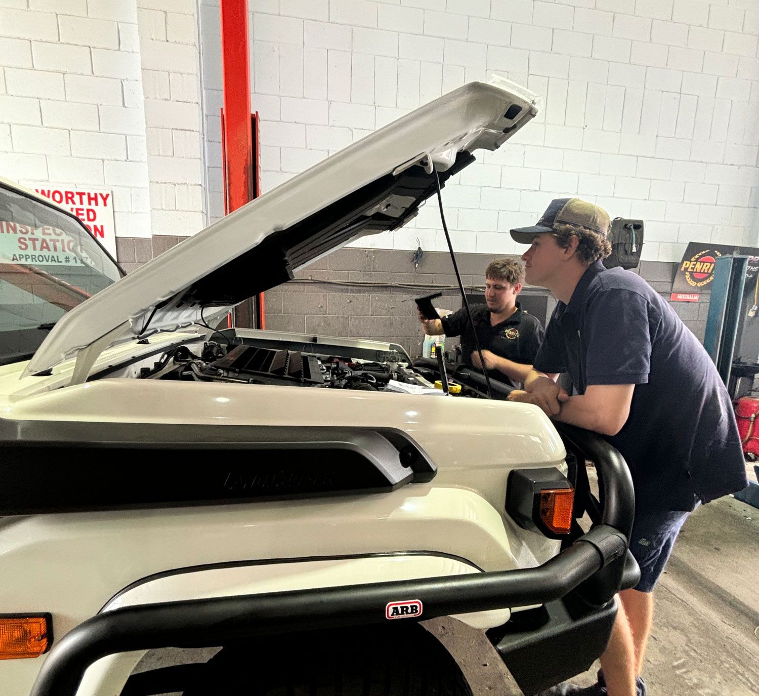 Mechanics In Caloundra Inspecting A Vehicle