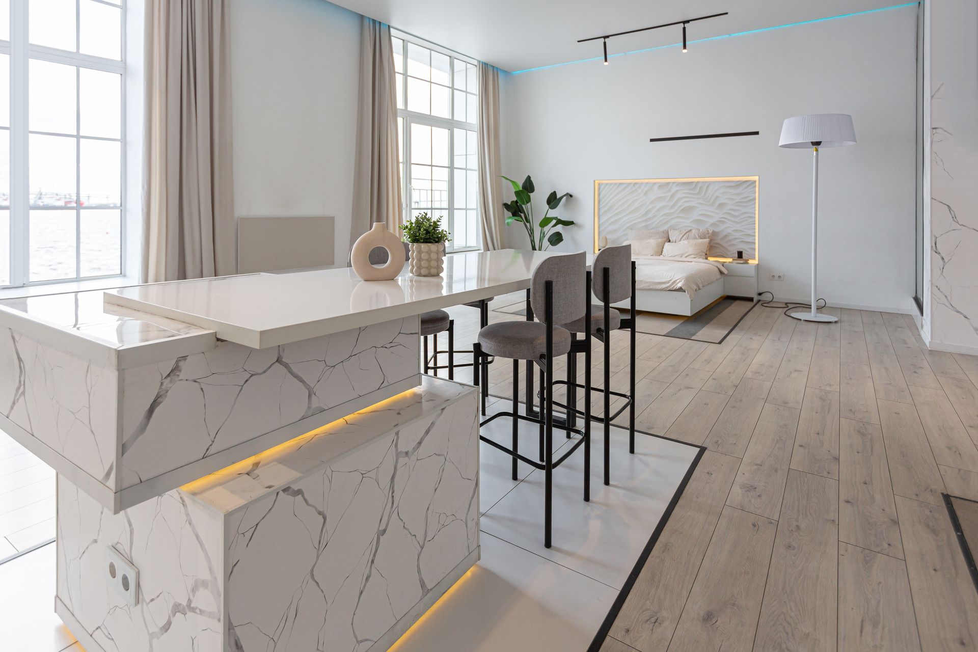A living room with a kitchen , dining room , and bedroom.