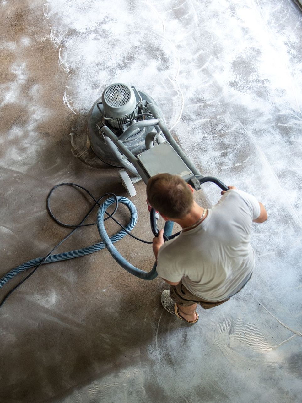 man polishing concrete floor