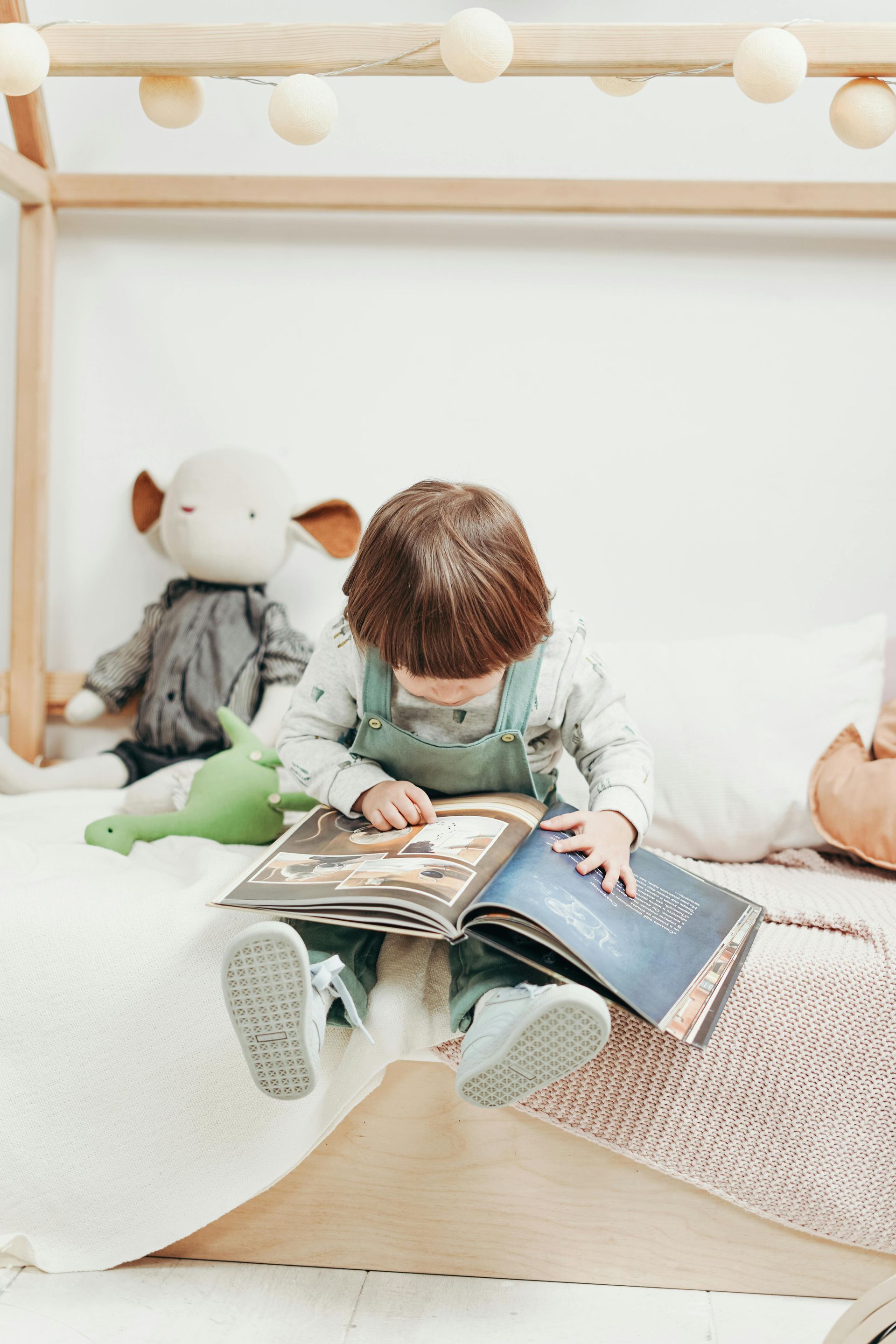 young child looking at a book
