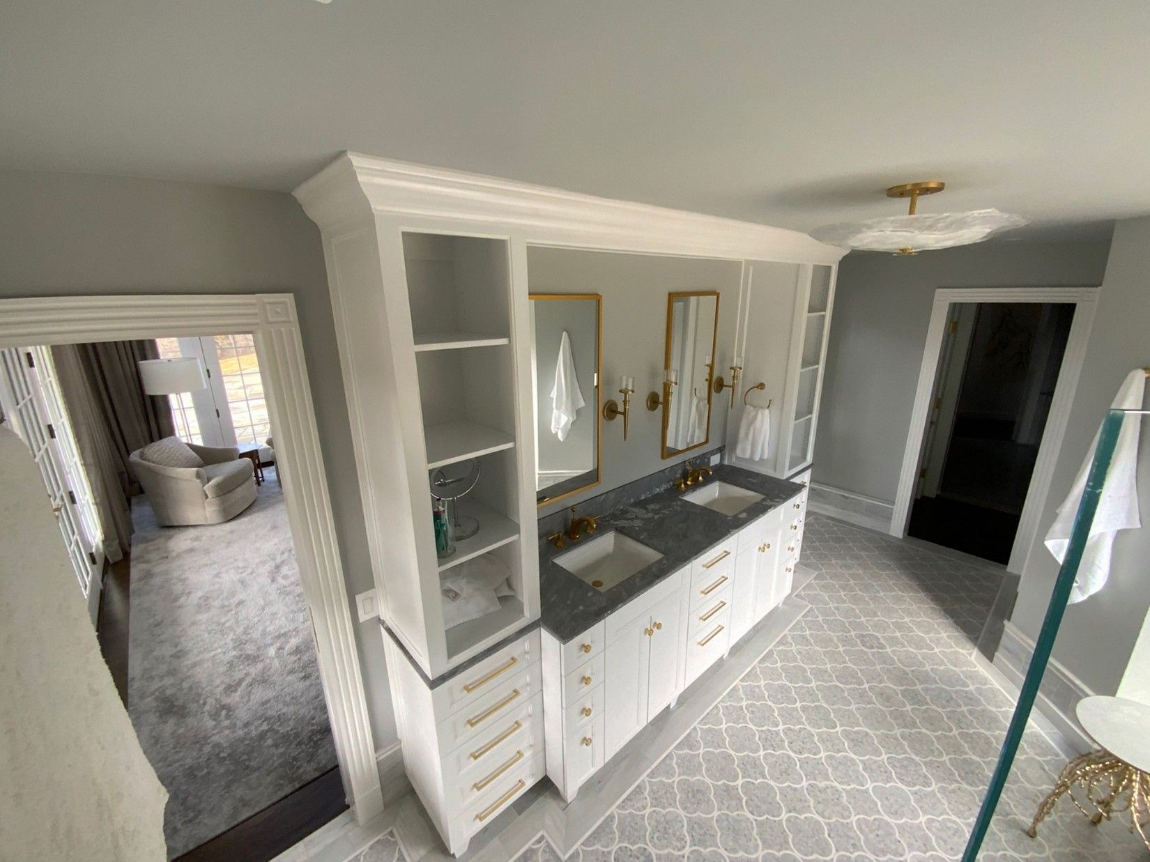 A bathroom with two sinks and two mirrors.