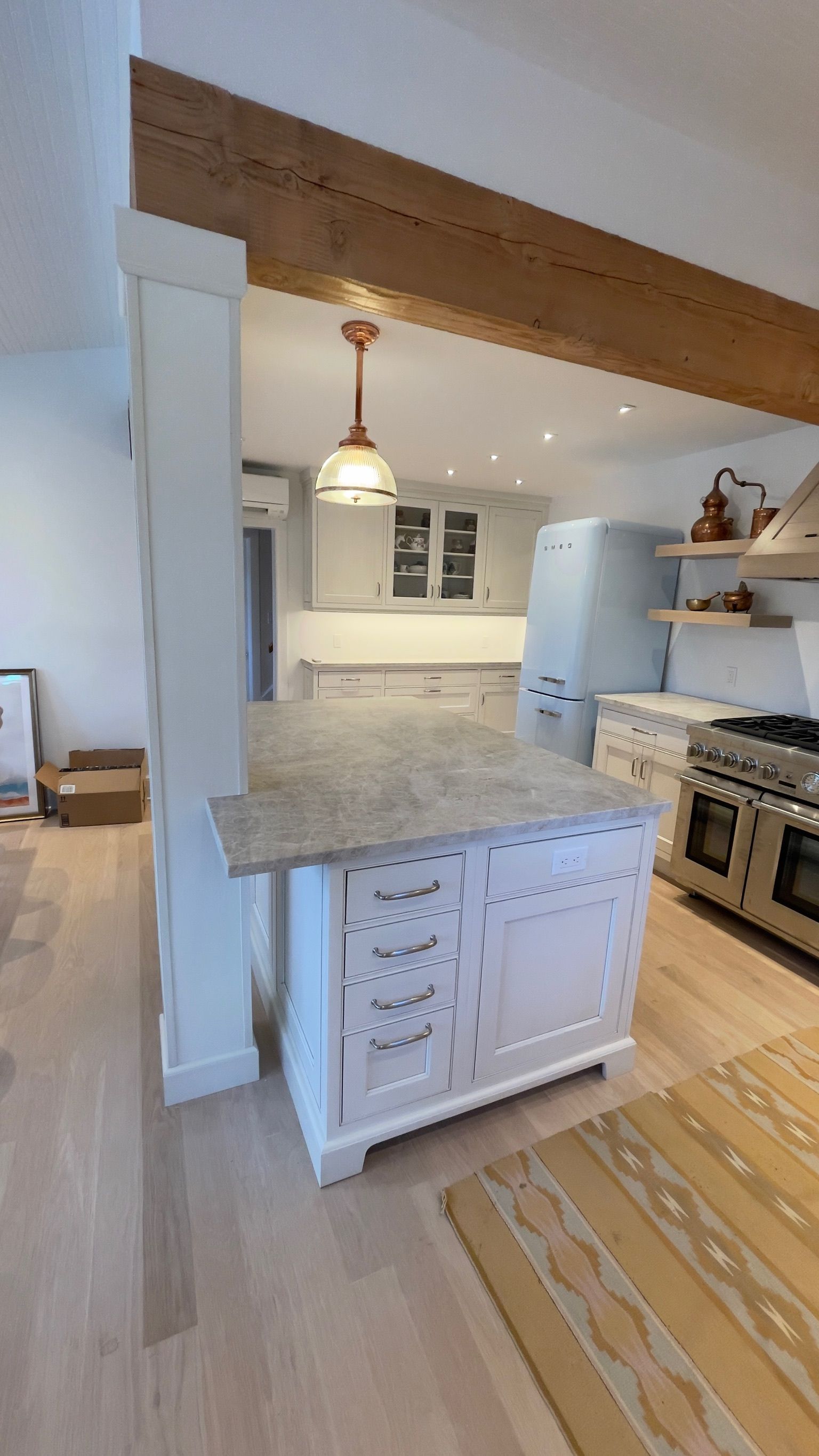 A kitchen with a large island in the middle of the room.