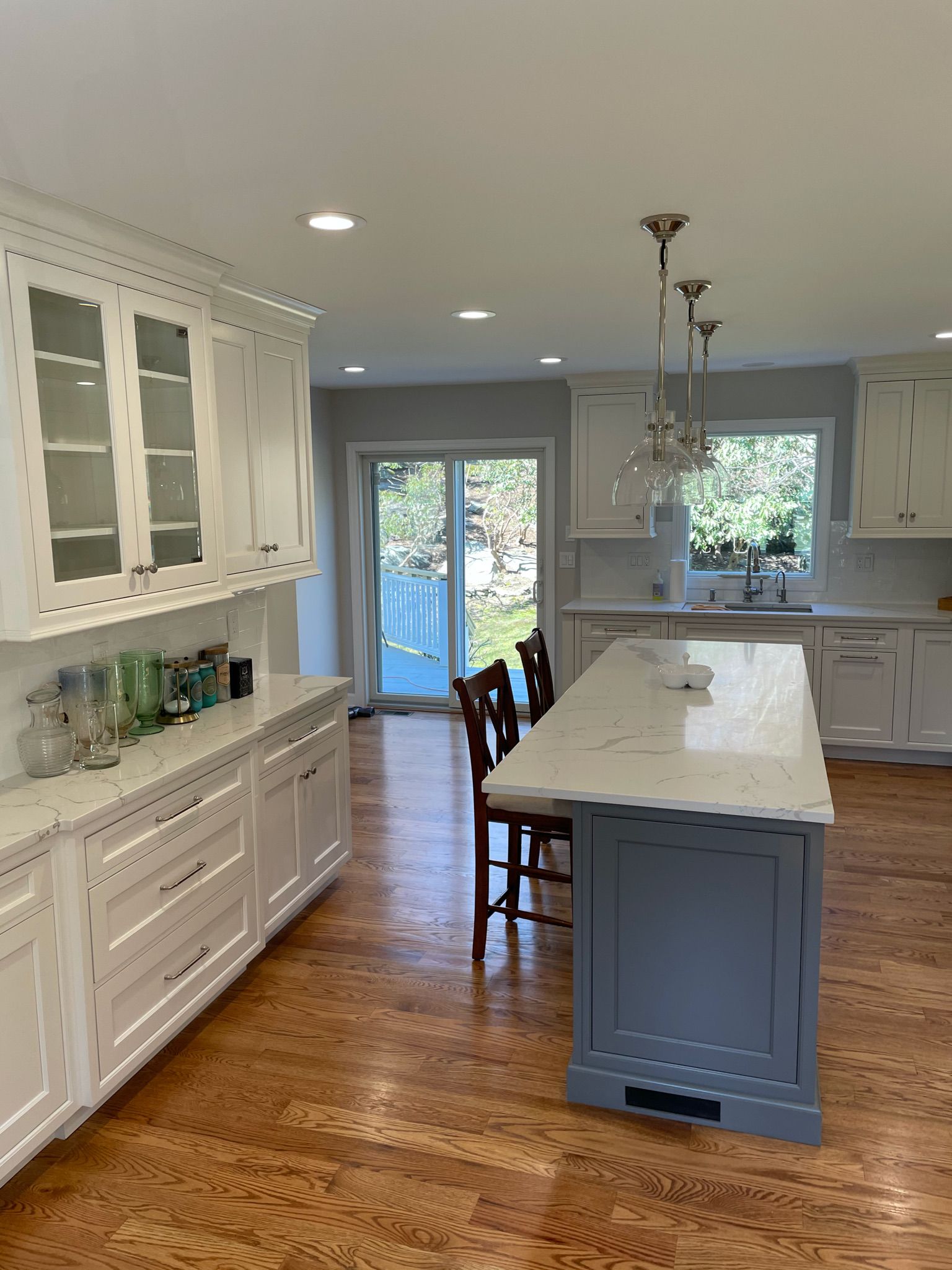 There is a large island in the middle of the kitchen.