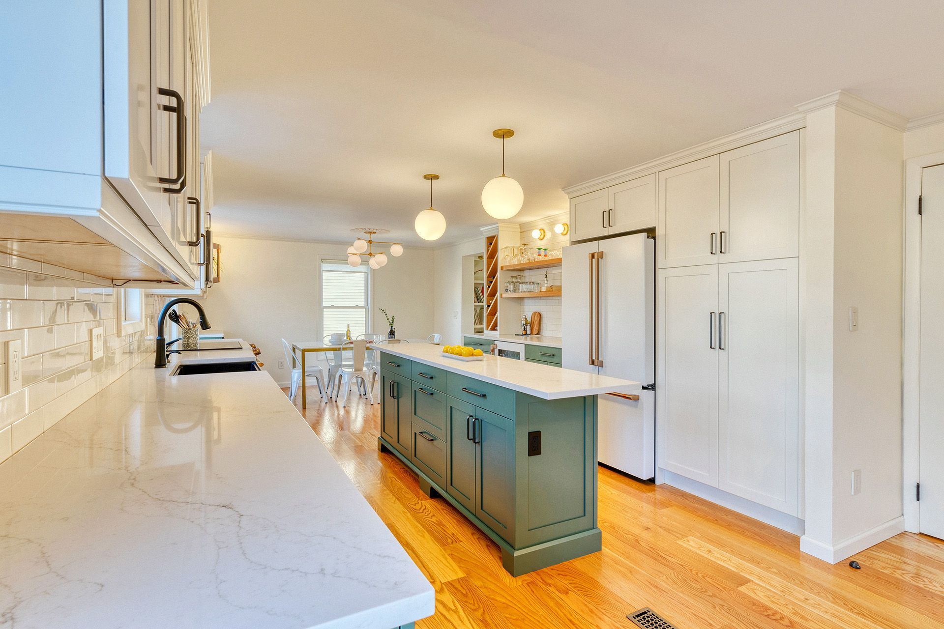 There is a large island in the middle of the kitchen.