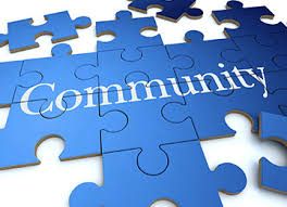 A blue puzzle with the word community written on it.