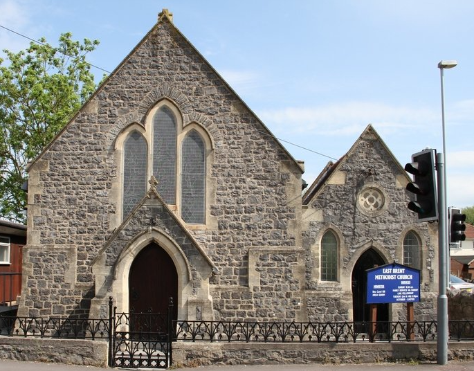 A brick building with a blue sign that says ' st. mary ' on it