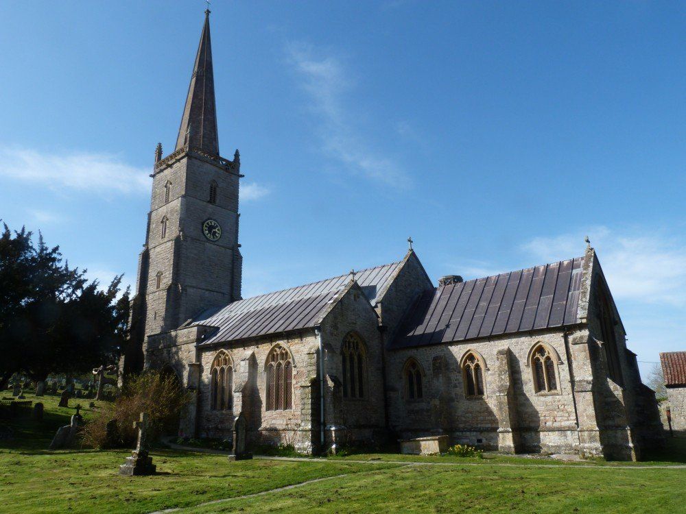 A large church with a steeple and a clock tower