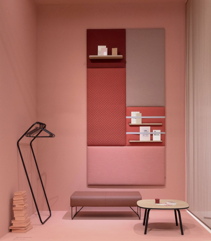 Modern minimalist pink room interior with red shelving unit.