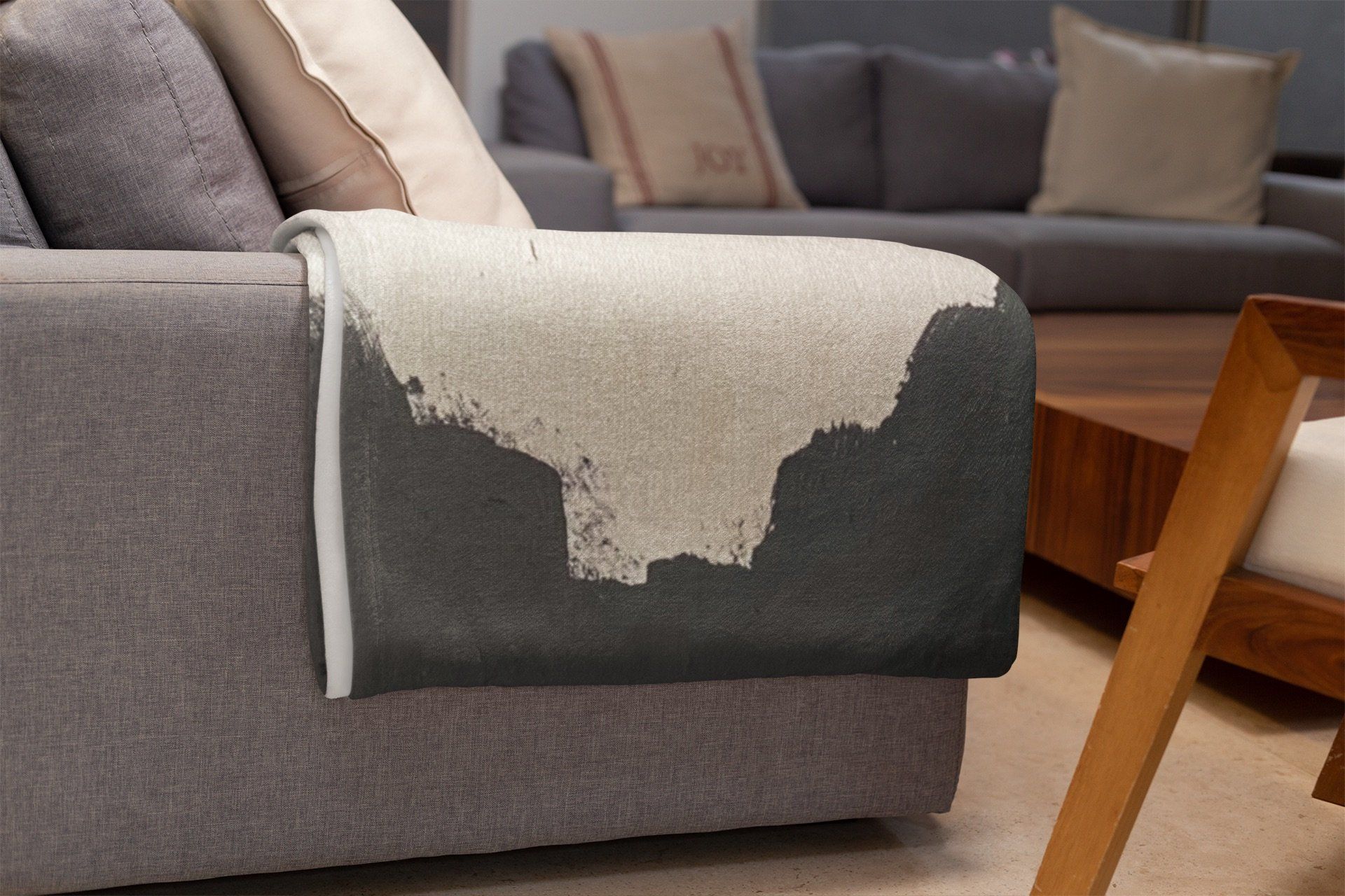 A couch with a blanket on it in a living room