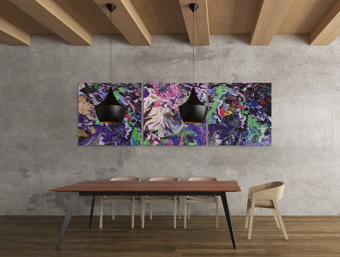 A dining room with a table and chairs and a painting on the wall