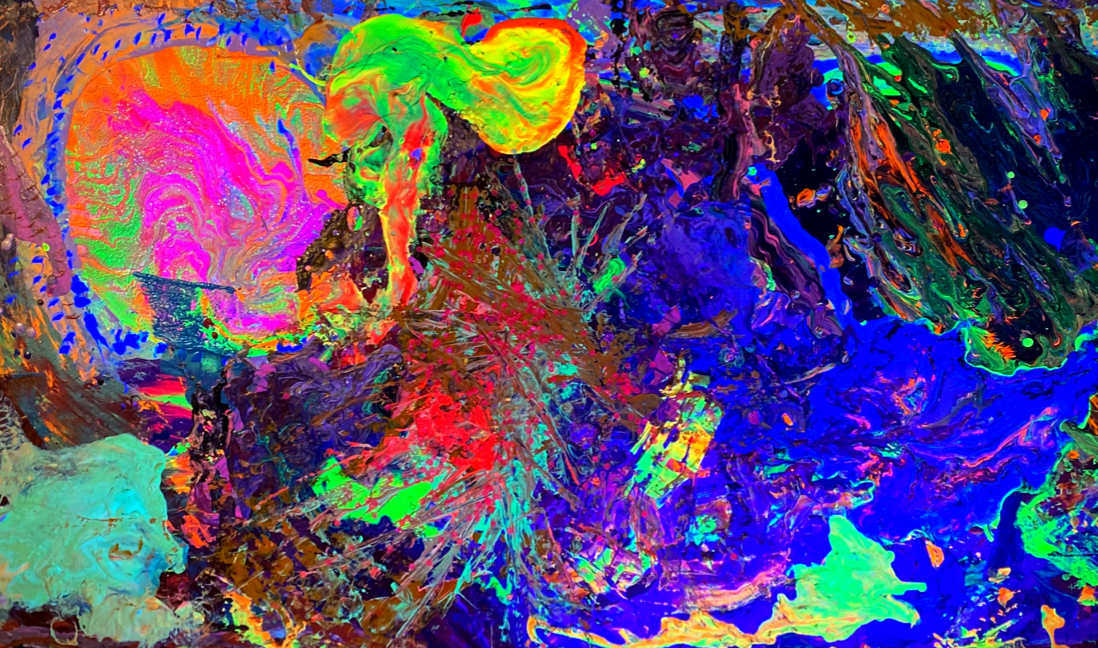 A close up of a colorful painting on a wall.