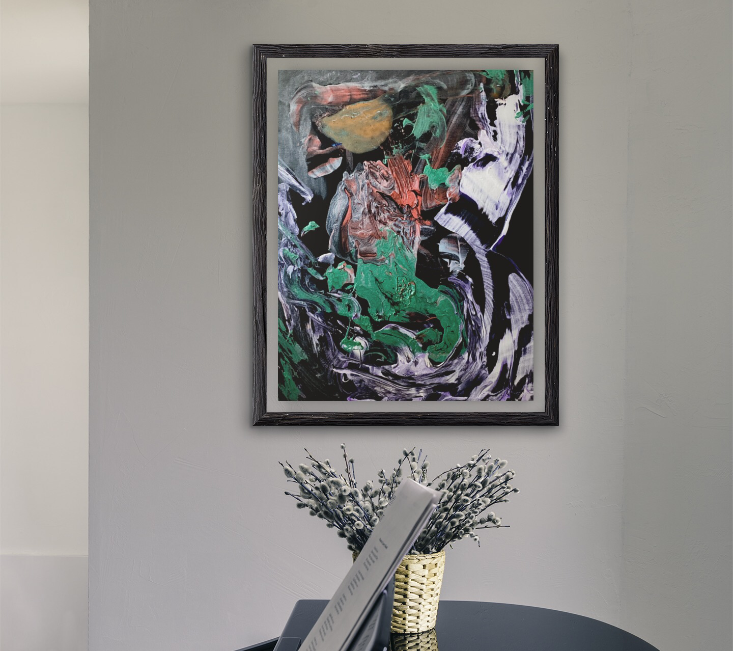 A painting is hanging on a wall next to a vase of flowers