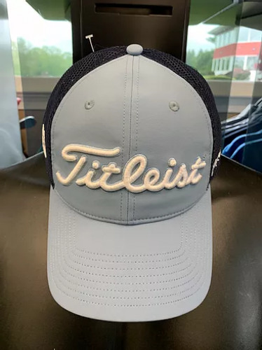 A golf hat with the word titleist on it