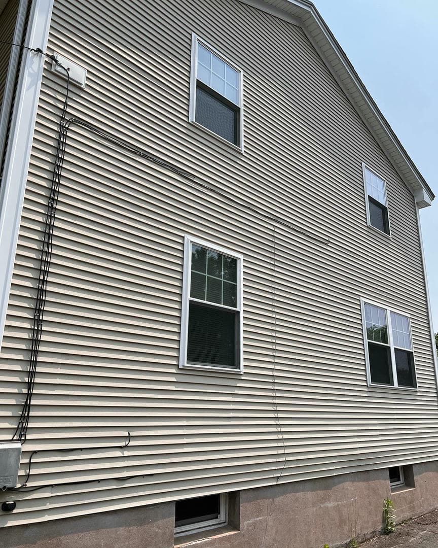A house with a lot of windows on the side of it