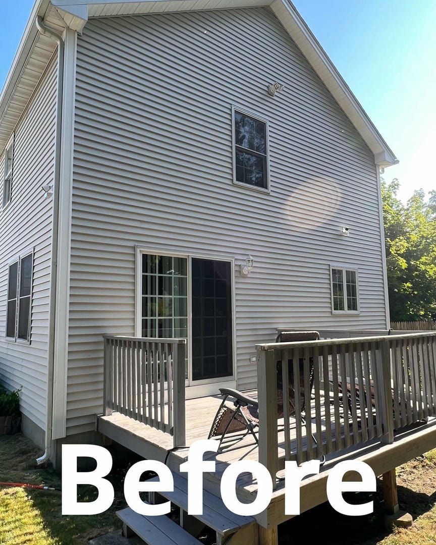 A before picture of a house with a deck
