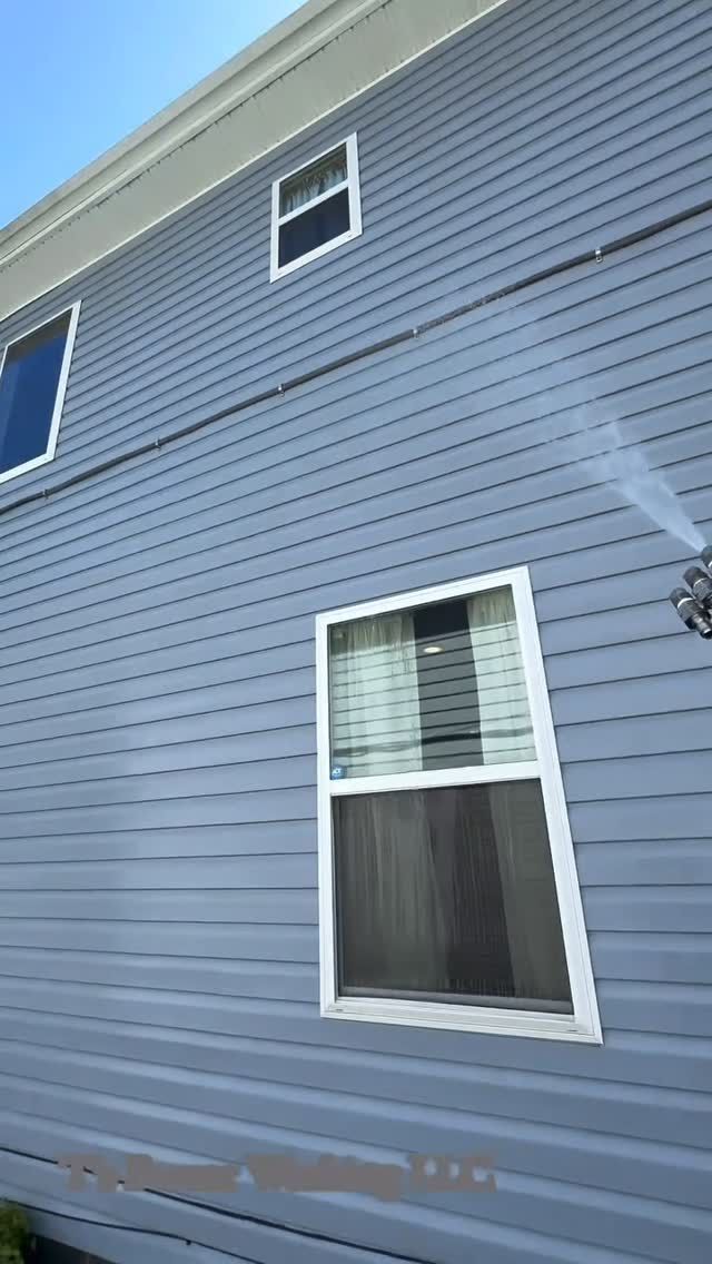 A house with a window on the side of it.